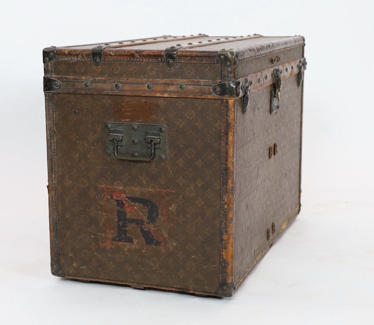 A Louis Vuitton brass mounted leather bound trunk, c.1910, numbered 137426, 75cm wide, 43cm deep, 54cm high